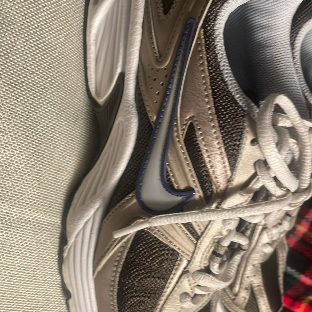 Nike women broken and brown sneakers .